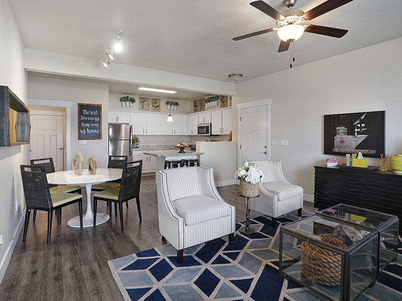 Living Room with Ceiling Fan and Rug | Draper Village