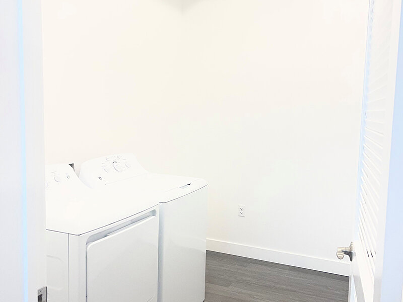 Washer and Dryer with Wood Style Flooring | Pacific Place Apartments