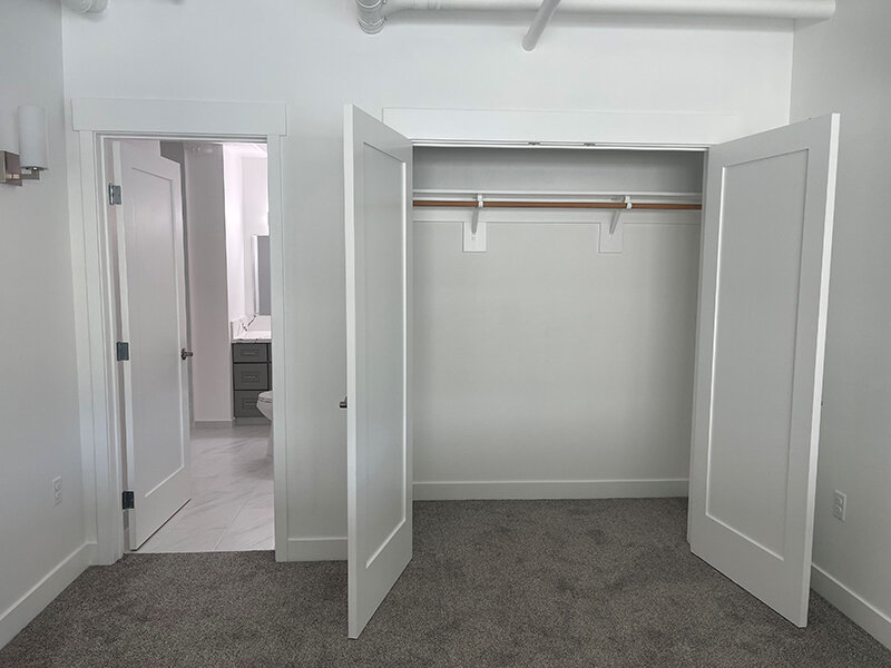 Bedroom Closet with Carpet Floors and Entrance to Bathroom | Pacific Place Apartments