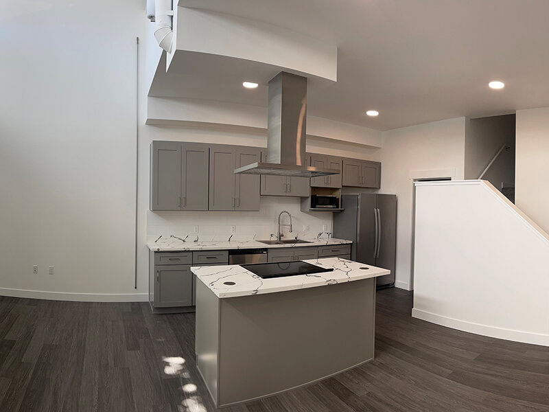 Kitchen with Wood Style Flooring and Kitchen Appliances | Pacific Place Apartments