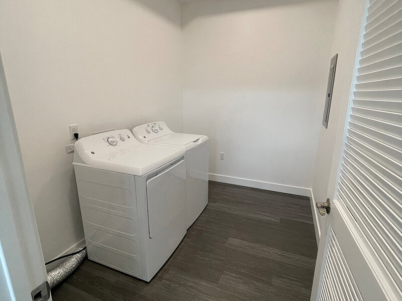 Laundry Room with Wood Style Flooring | Pacific Place Apartments