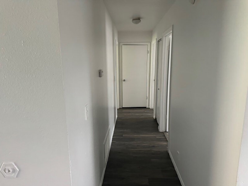 Apartment Hallway with Wood Style Flooring | Mulberry Park