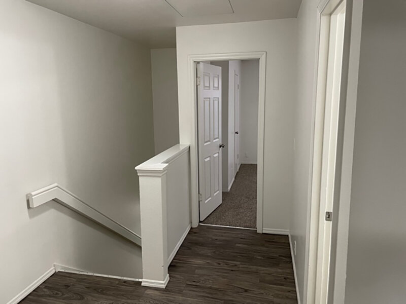 Staircase with Wood Style Flooring and Bedroom with Carpet | Mulberry Park