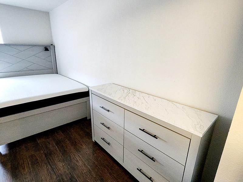 Bedroom with Wood Plank Floors | Onyx at Oslo Apartments in San Antonio, TX