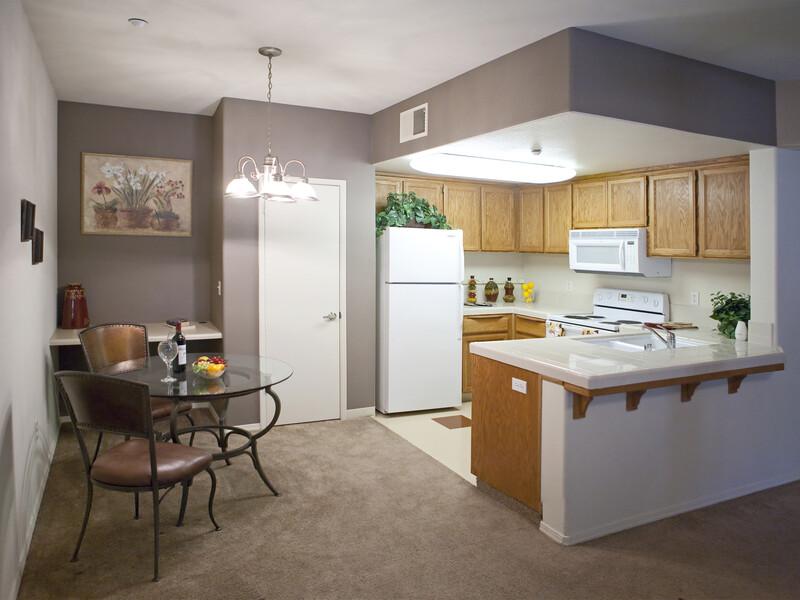 Dining Room and Kitchen | Luxe West Apartments in Fresno, CA