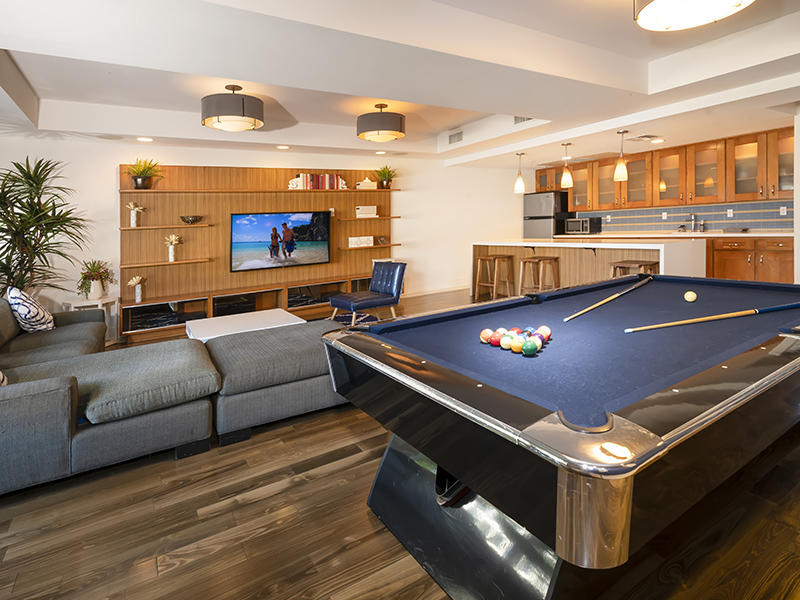 Studio City CA Apartments - The Thomas Apartments - Pool Table, Kitchenette, Mounted Television with Shelving, and Seating Area