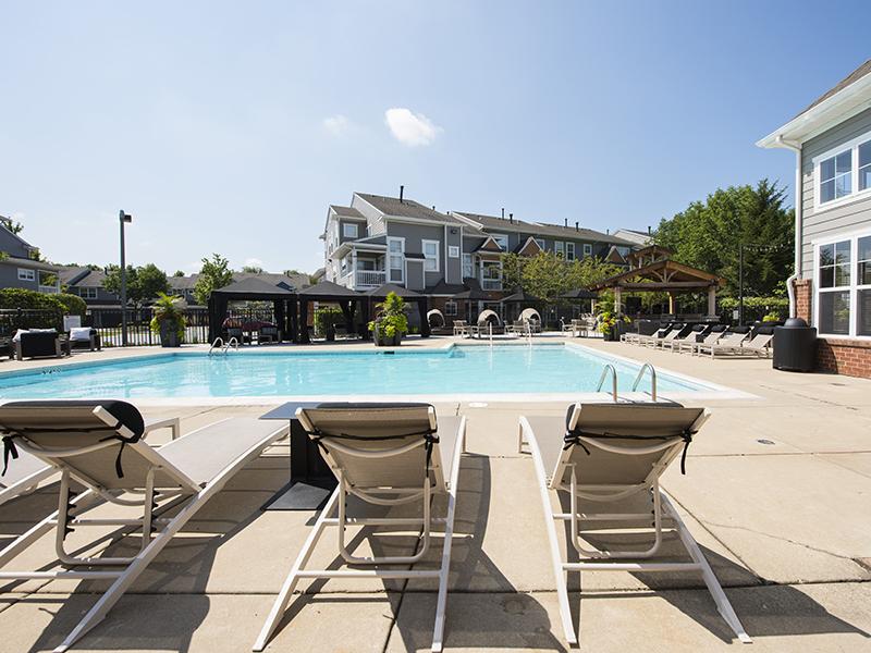 Naperville, IL Apartments- Grand Reserve of Naperville - Resort-Style Swimming Pool with Lounge Chairs and Cabanas