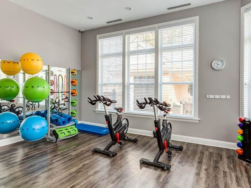 Apartments for Rent in Naperville, IL - River Run at Naperville - Fitness Center with Stationary Bikes, Workout Equipment and Free Weights