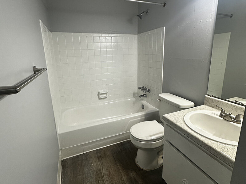 Bathroom with Shower and Wood Style Flooring | Ashland Commons Apartments