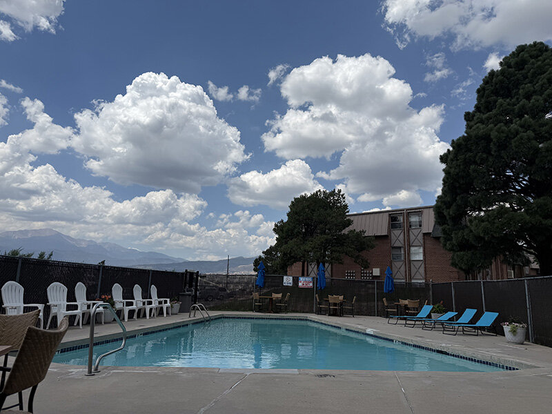 Outdoor Pool with Chairs and Trees | Spring Creek