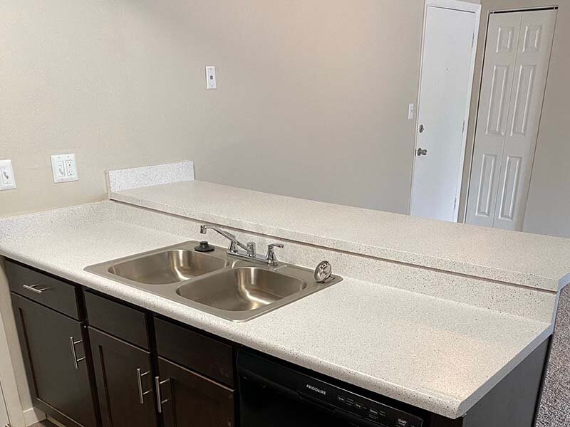 Kitchen Sink & Dishwasher | Spring Creek Apartments in  Colorado Springs, CO