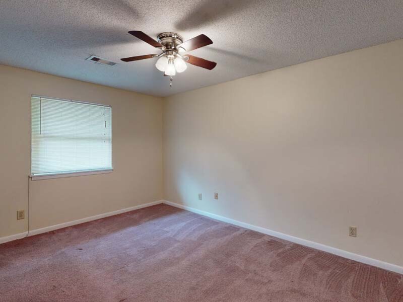 Bedroom with Ceiling Fans | Holiday Cove in Forsyth, GA