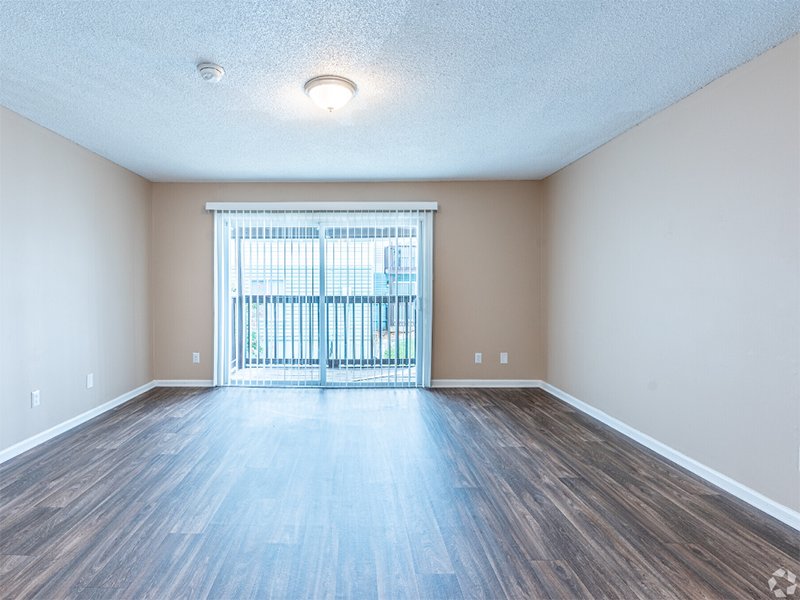 Living Room and Balcony | The Regency Apartments