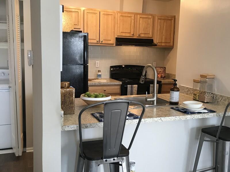 Kitchen and Seating  | The Madison at Eden Brook Apartments in Columbia, MD