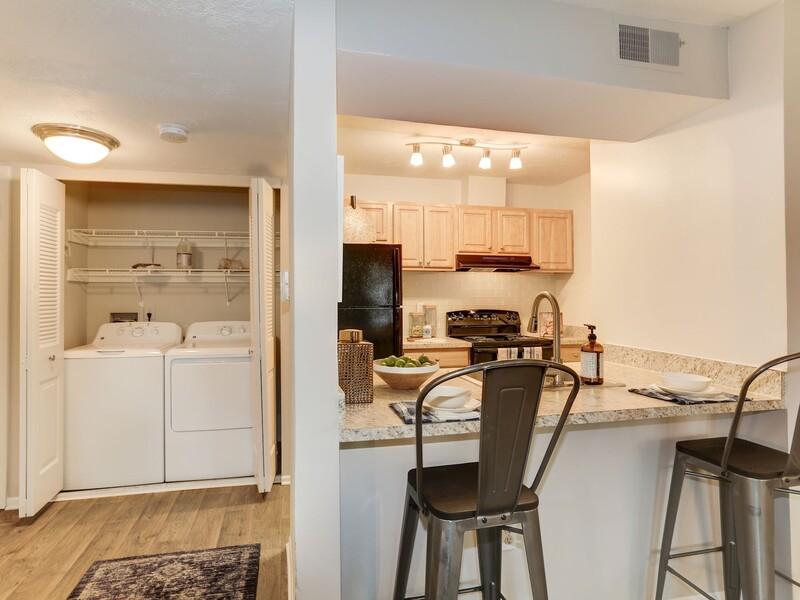 Kitchen and Laundry | The Madison at Eden Brook Apartments in Columbia, MD