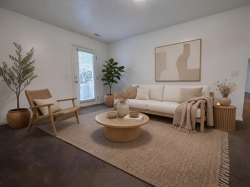 Living Room with Seating and Wall Art with Window | Autumn Hills Apartments