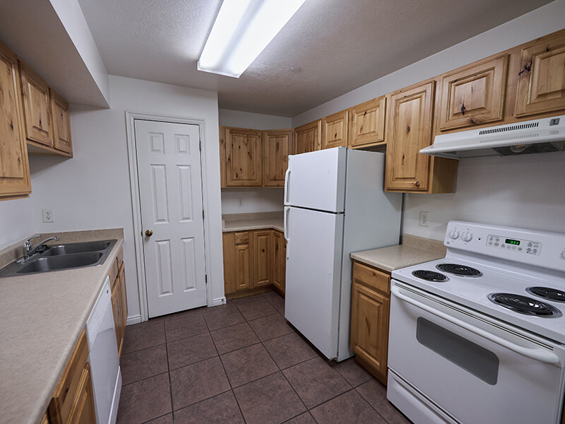 Kitchen with Appliances and Tile Flooring | Autumn Hills Apartments