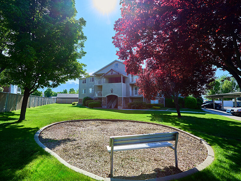 Apartment Property with Community Bench | Autumn Hills Apartments