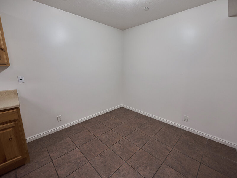 Bedroom with Brown Carpeted Flooring | Autumn Hills Apartments