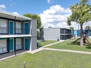 Courtyard with Playground and Picnic Tables | bluHaven Apartments