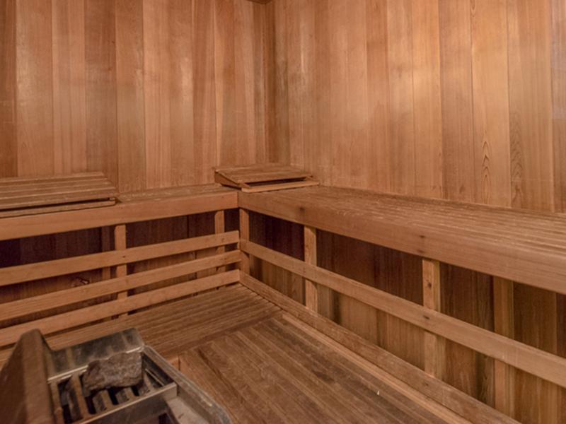 The sauna has teak benches and a heating element at Bridgewater at Town Center Apartments in Hampton.