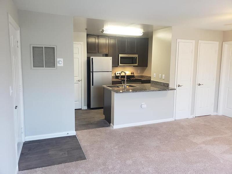 Model apartments in Hampton with kitchen, dining area and living room. 