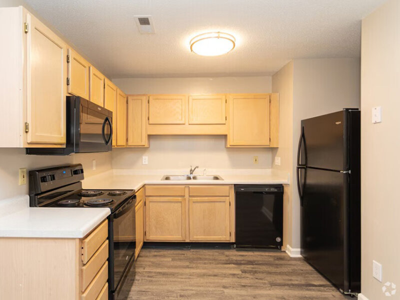 Kitchen with Black Appliances | Carolina Oaks Apartments