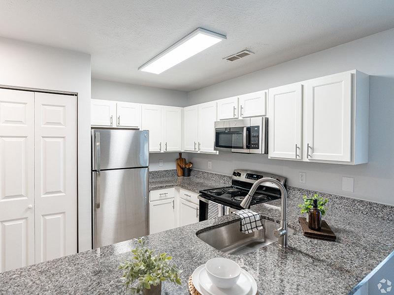 Modern Kitchen with Stainless-Steel Appliances + Granite Countertops | Cliffdale Crossing