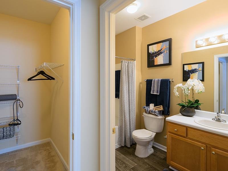 A walk-in closet and bathroom is attached to a bedroom in the apartments at Colton Creek in McDonough.