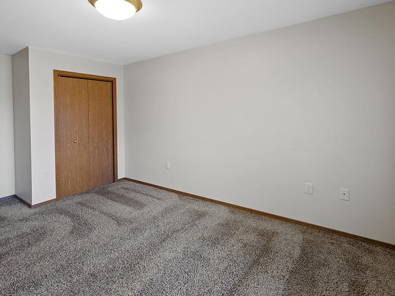 Bedroom and Closet | Dakota Pointe Apartments in Sioux Falls, SD