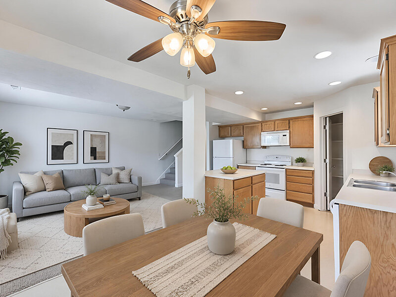 Dining Room Table with Ceiling Fan and Entry to Kitchen | Garden View Townhomes