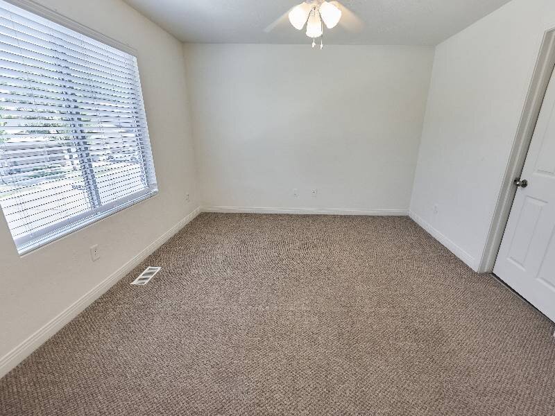 Carpeted Bedroom | Garden View Townhomes