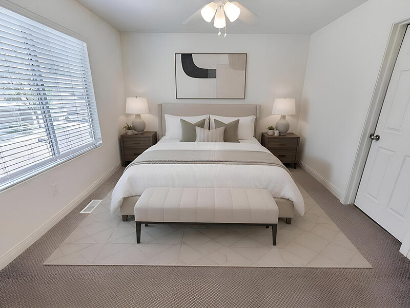 Bedroom with Wall Art and Ceiling Light | Garden View Townhomes