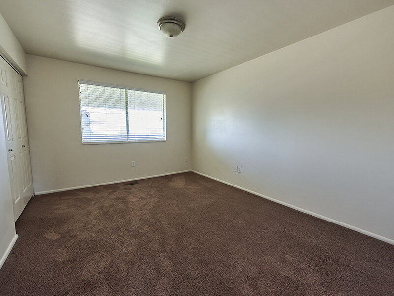 Apartment Bedroom with Window and Ceiling Light | Kaysville Country Townhomes