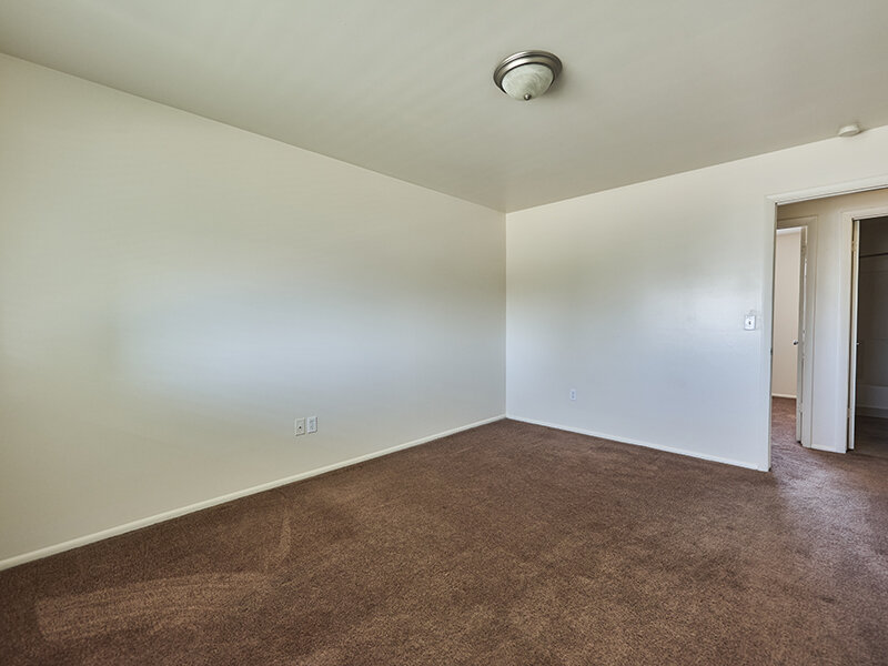 Apartment Bedroom with Ceiling Light and Carpeted Floors | Kaysville Country Townhomes