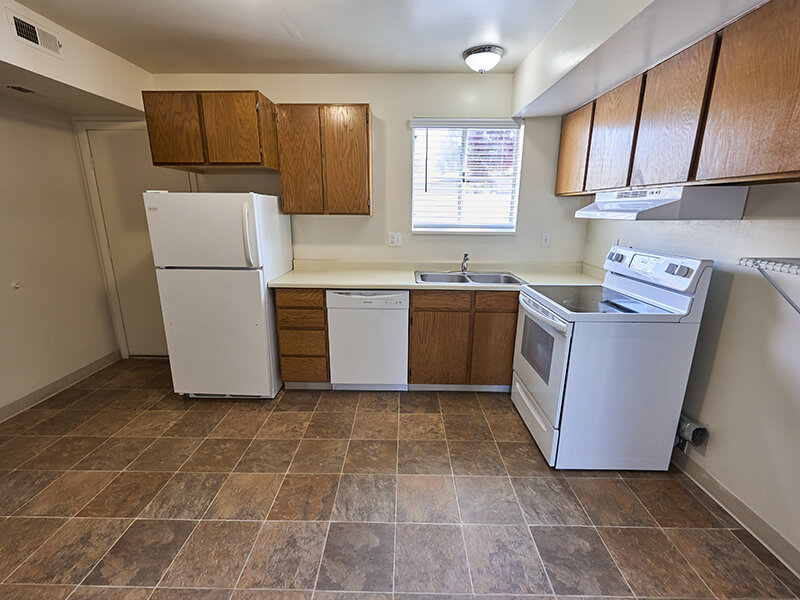 Kitchen with Wood Styled Cabinets and Tile Flooring | Kaysville Country Townhomes