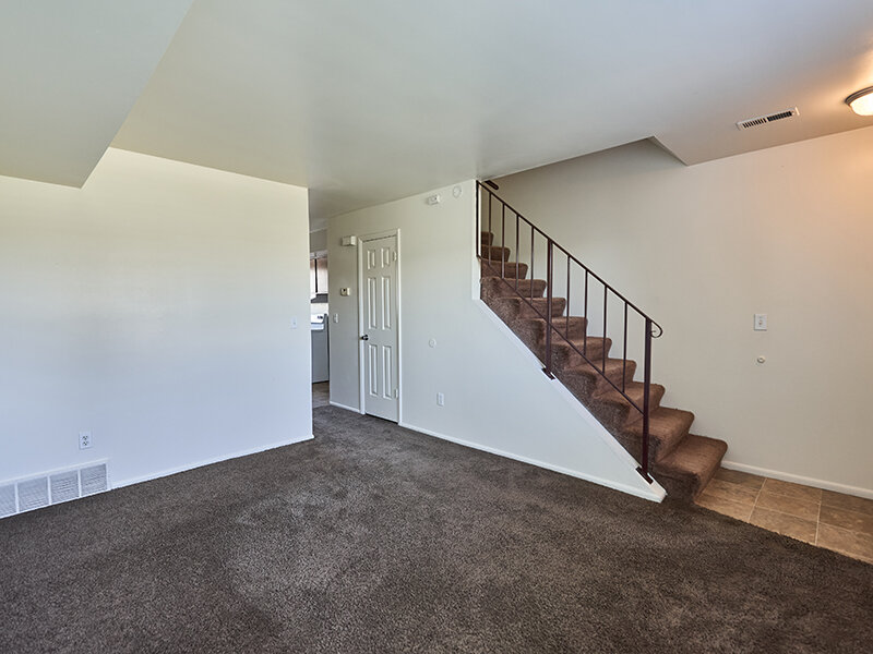 Living Room with Stairwell and Carpeted Flooring | Kaysville Country Townhomes
