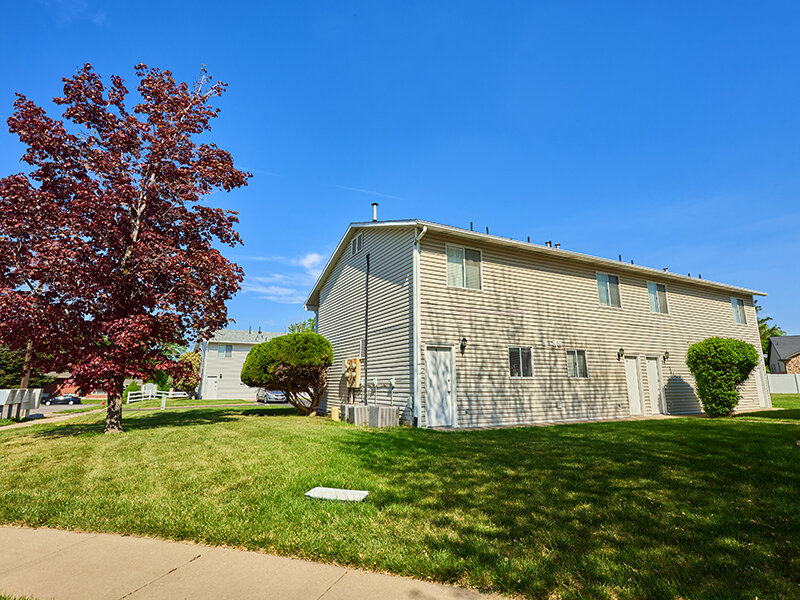 Exterior View of Apartment Property with Trees and Sidewalk | Kaysville Country Townhomes