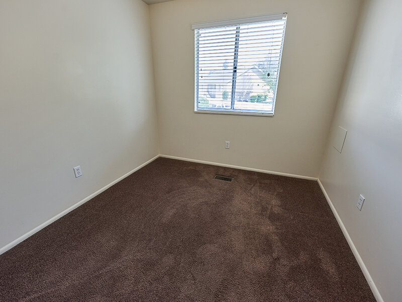 Bedroom with Window and Carpet Flooring | Kaysville Country Townhomes