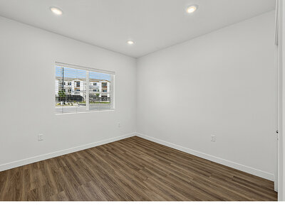 Bedroom with Wood Flooring | Kuna Commons