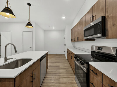 Kitchen with Electric Range and Dishwasher | Kuna Commons