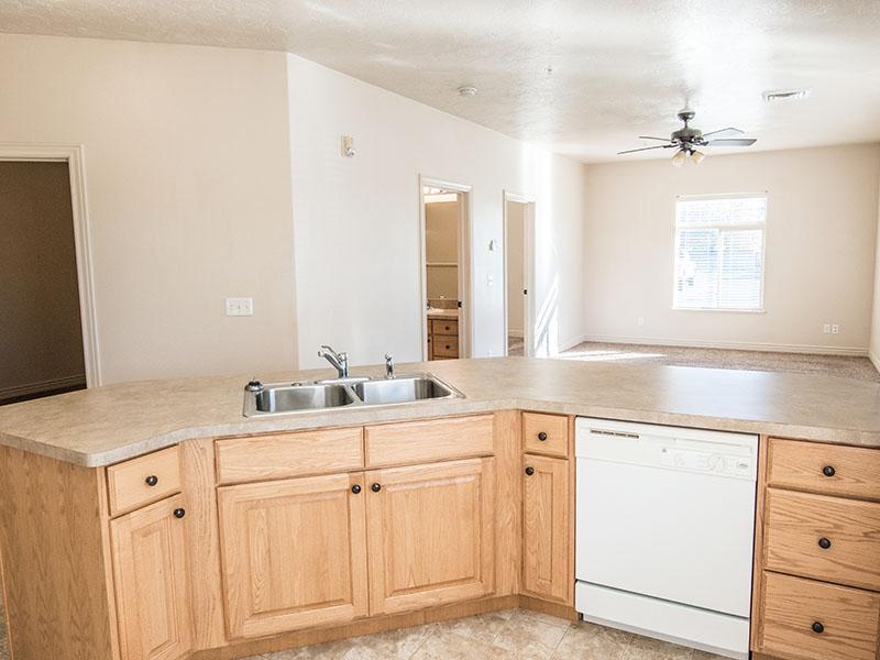 Kitchen with White Appliances | Liberty Square Apartments in Ammon, ID