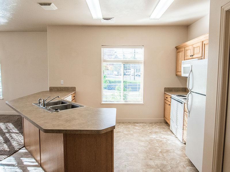Kitchen with Window | Liberty Square Apartments in Ammon, ID
