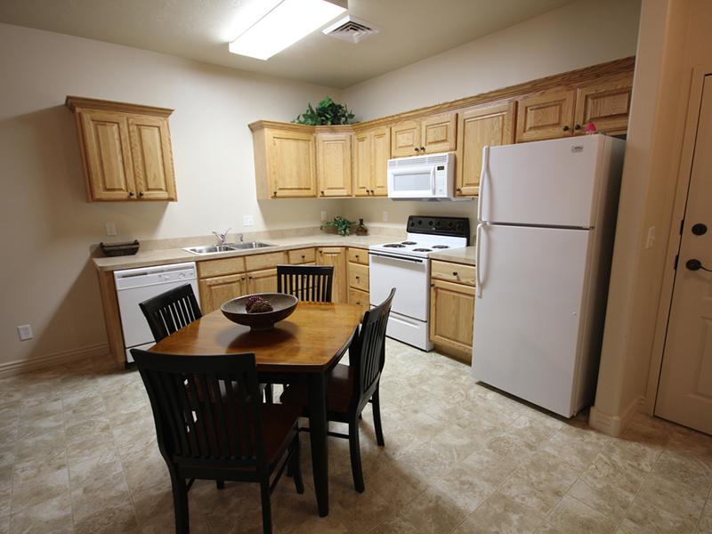 Dining Area and Kitchen | Liberty Square Apartments in Ammon, ID