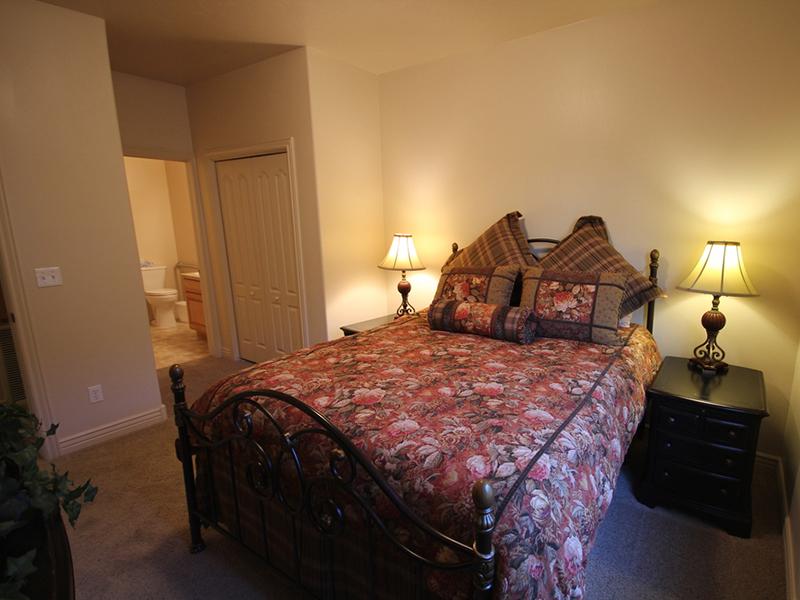 Bedroom and Bathroom | Liberty Square Apartments in Ammon, ID
