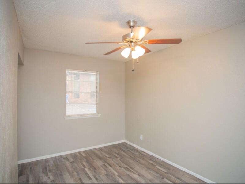 Bedroom with a Ceiling Fan | Buena Vista Apartments in Fort Worth, TX