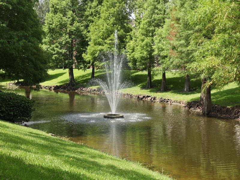 The landscaped grounds have a Lakes with a fountain.