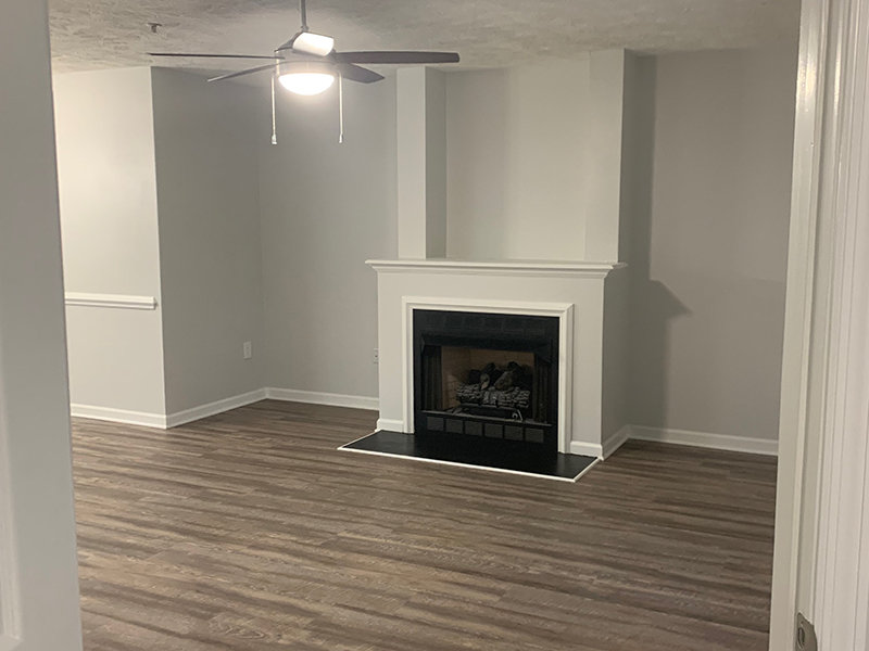 Living Room with a Fireplace | Regency Apartments