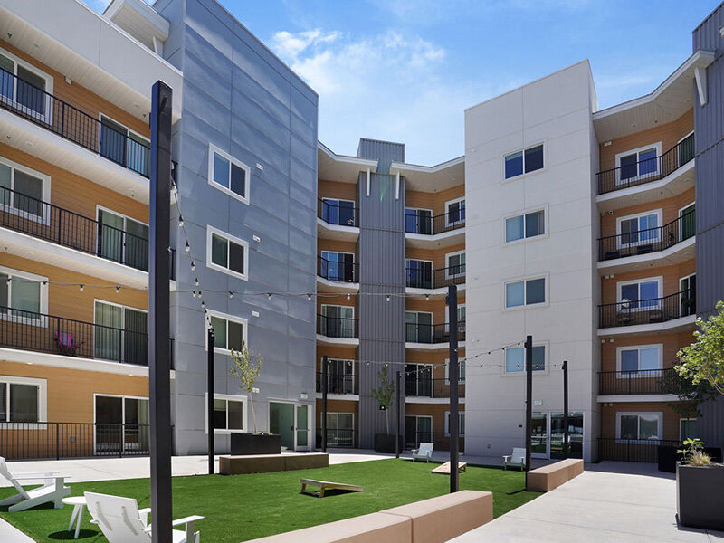 Courtyard with Cornhole Court | Skyline Peaks Apartments