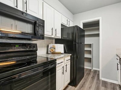 Fully Equipped Kitchen with Black Appliances | Terrace Oaks